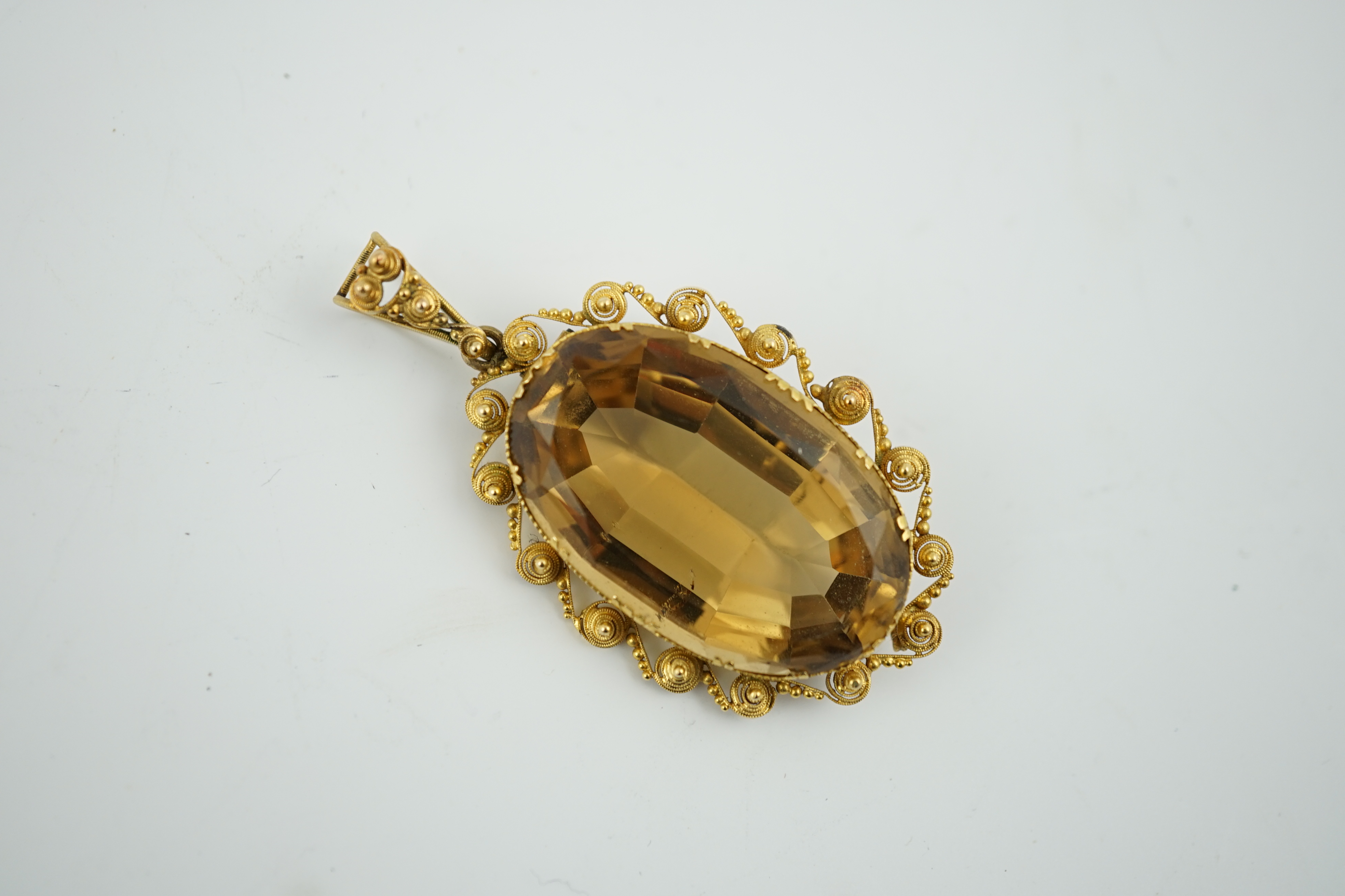 A Victorian style gold and oval cut citrine set pendant